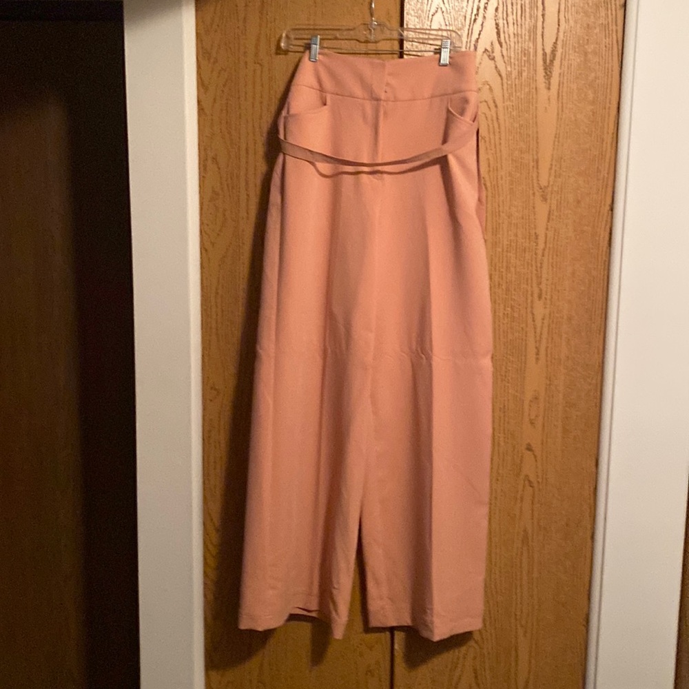 Peach wide leg pants.